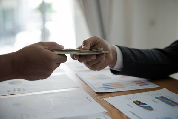 Handing cash over for payback